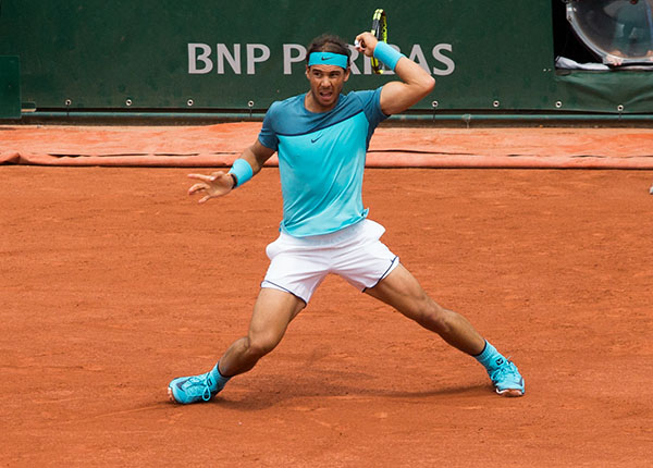 Rafael Nadal retrieves a ball at Roland Garros