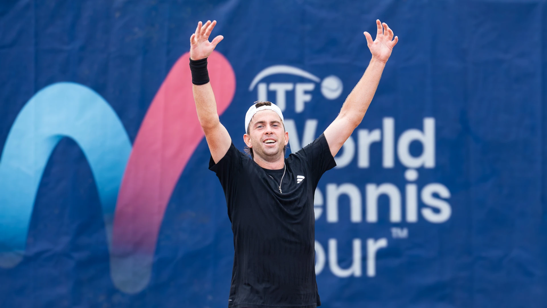Conor Gannon celebrates with his arms aloft