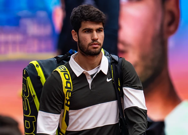Carlos Alcaraz carries his bag at Roland Garros 2025