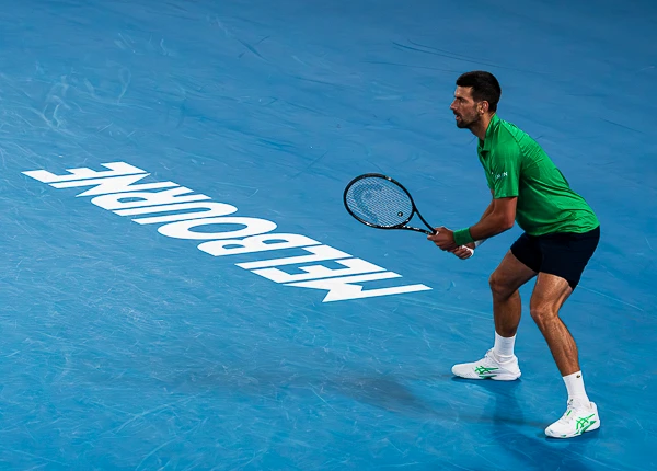 Novak Djokovic with the Melbourne sign